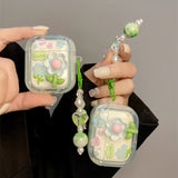 جراب سماعات AirPods مزين بزهرة لطيفة مع تعليقات ملونة